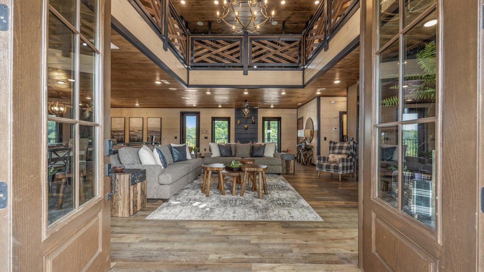 Designed mountain cabin great room with refined finishes